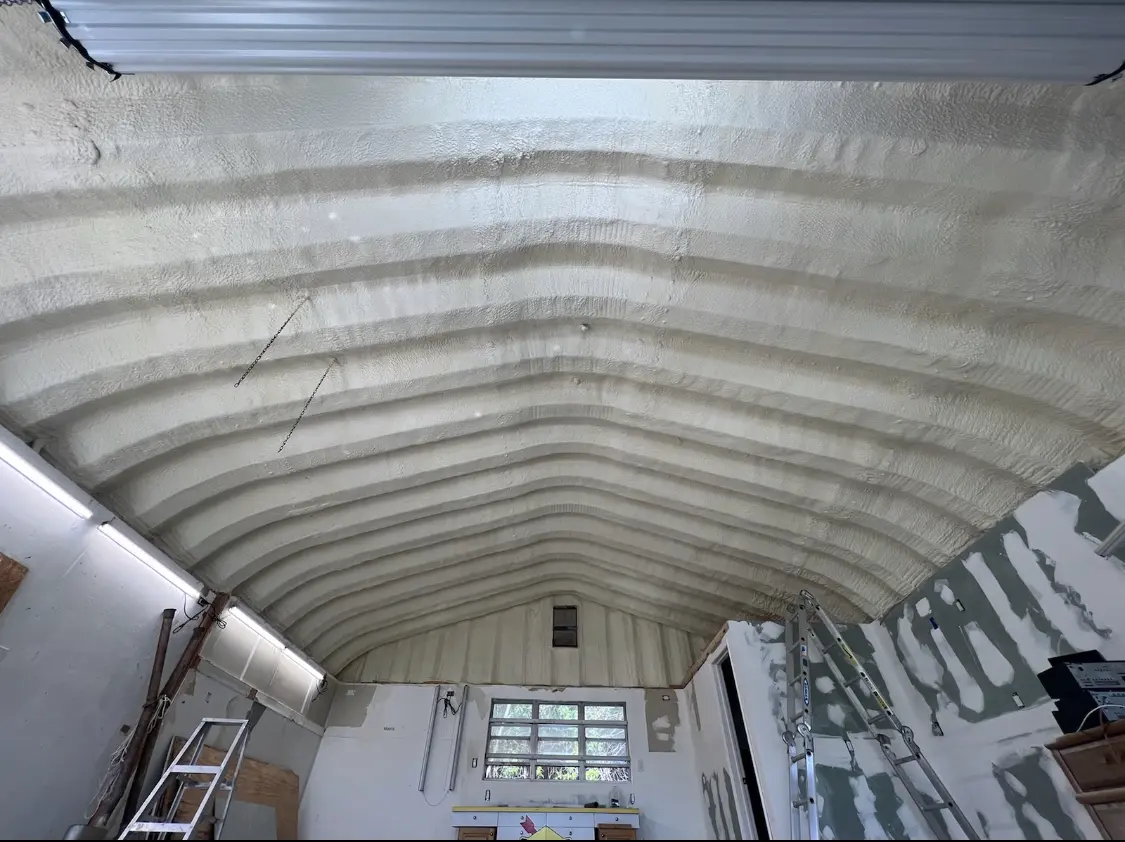 Spray polyurethane foam applied to the underside of a metal roof deck in Garwood